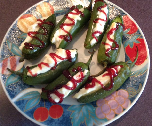 Cream Cheese Stuffed Jalapenos with Berry Sauce Drizzled Over Them
